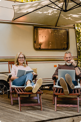 Person relaxing outside with a laptop