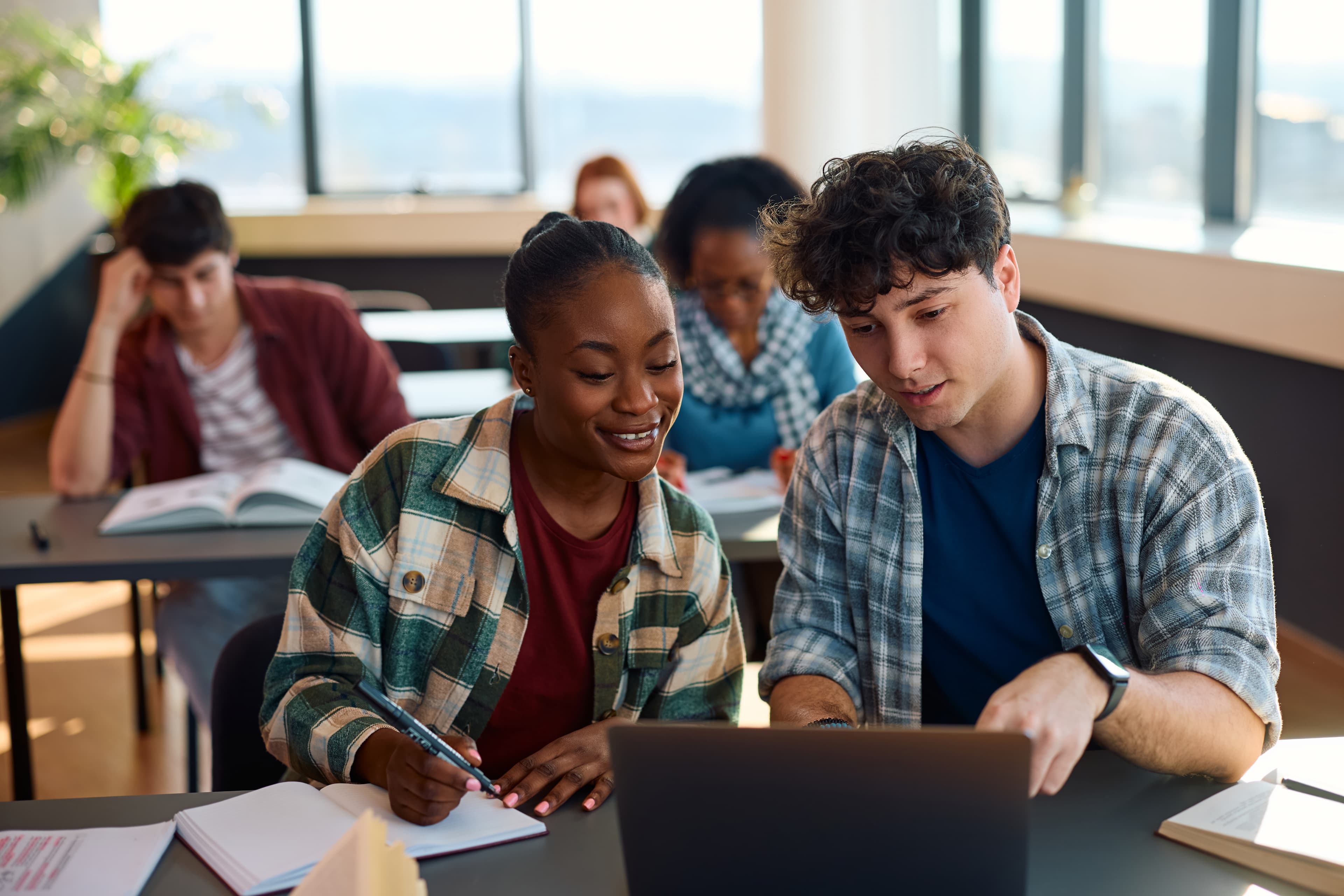 Students in a classroom with laptops