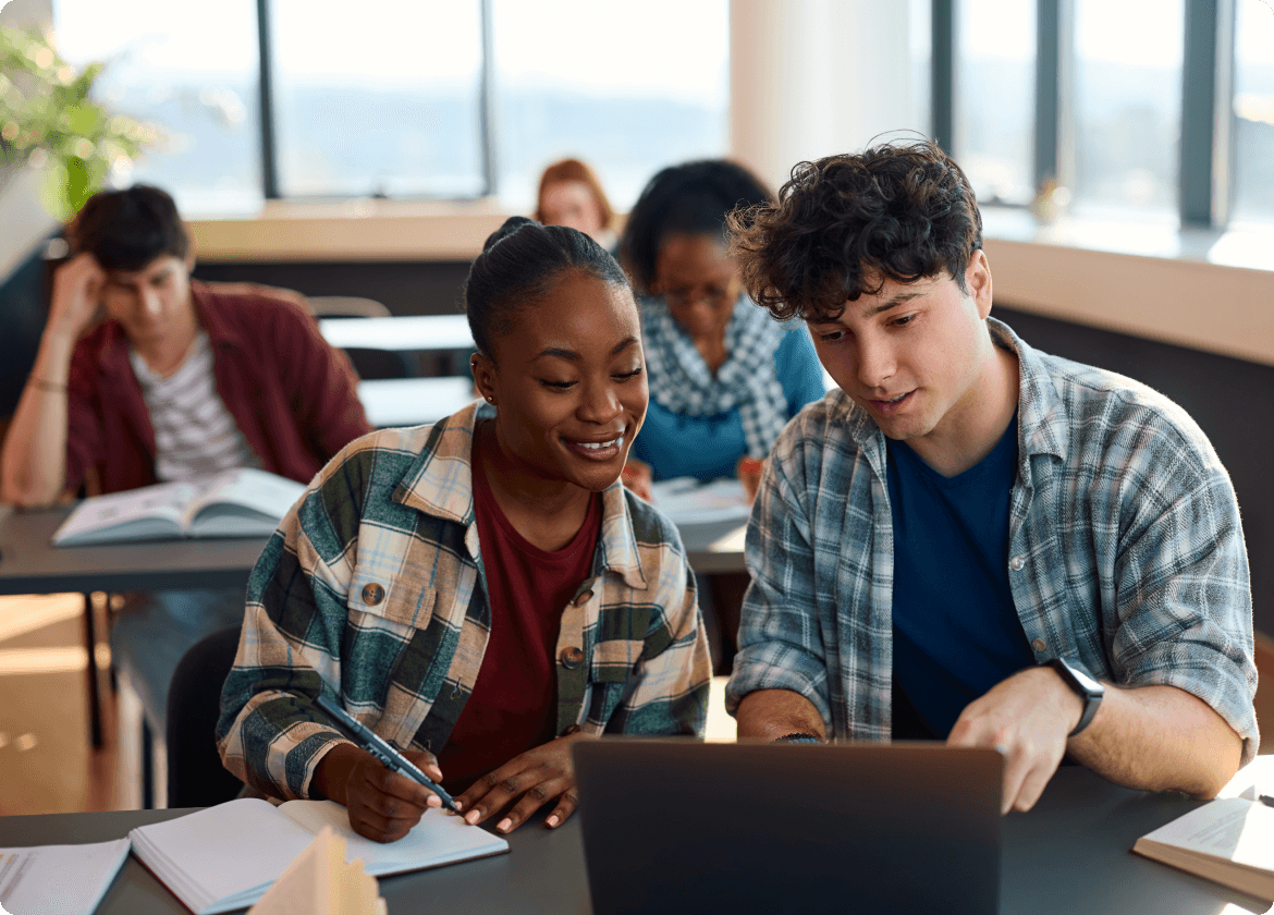 Students studying together with laptops